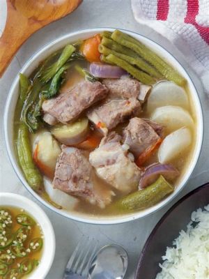  Sinigang na Baboy: Een Zuur Zoete Danspartij voor uw Smaakpapillen!