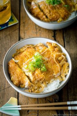  Katsudon: Een knapperig avontuur van rijst en vlees met een zoete saus!